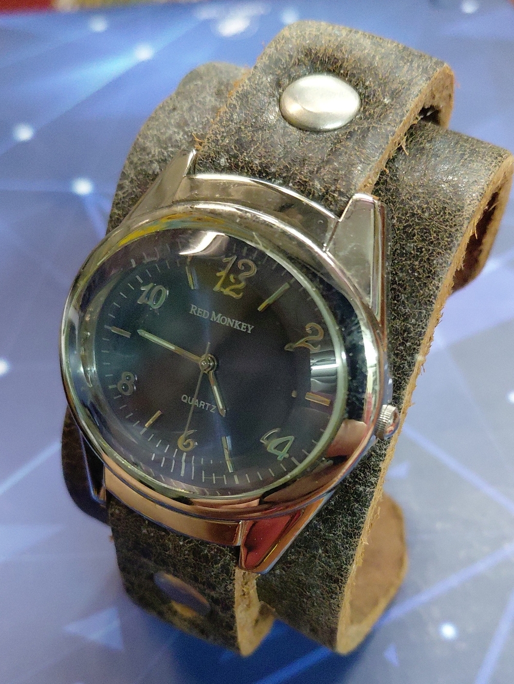 Red Monkey Blue Dial Watch on Brown Leather Cuff